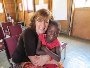 Becky with one of the Swazi orphans who have now found love and safety.