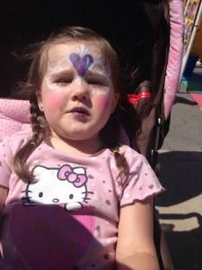 Festivals abound across the metro offering inexpensive fun for entire families. Here, Juliet sports a painted face at a festival in downtown Independence, Mo.