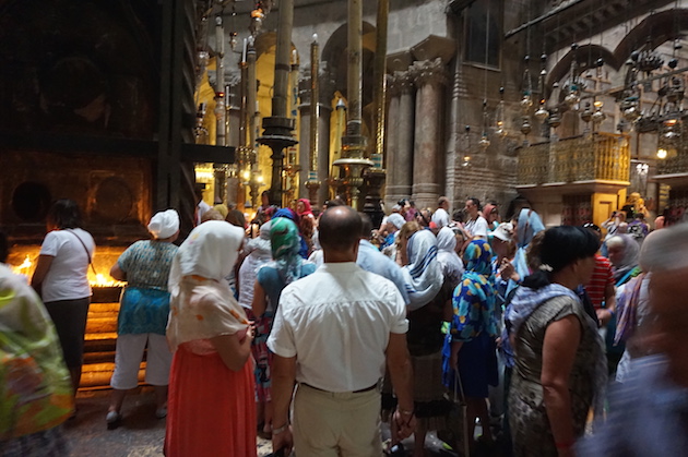 Tourists and pilgrims line for a view inside the Church of the Holy Sepulchre.